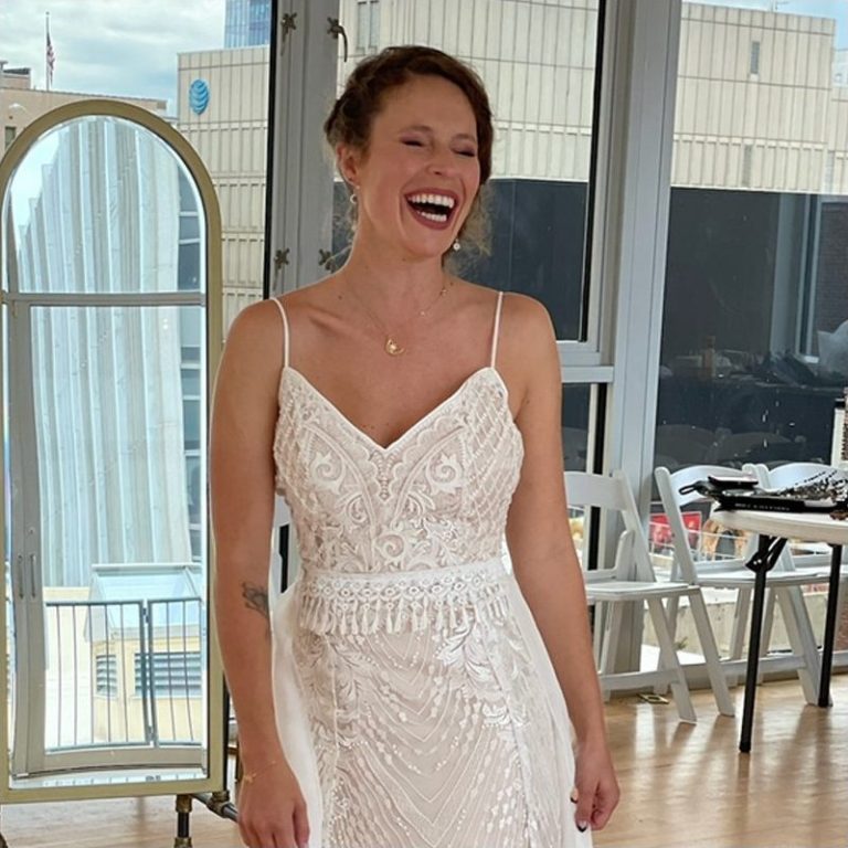 Angela laughing in her wedding dress